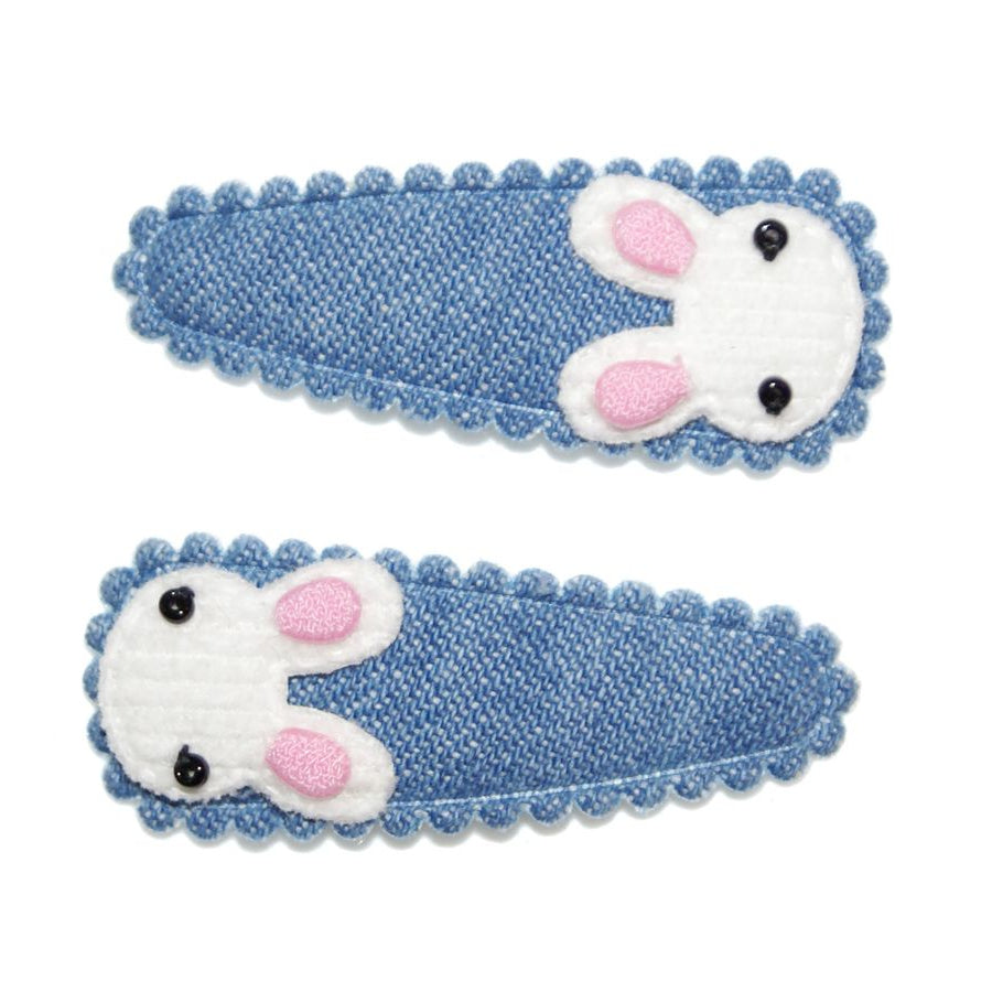 Two blue hair clips with white mouse designs on a white background