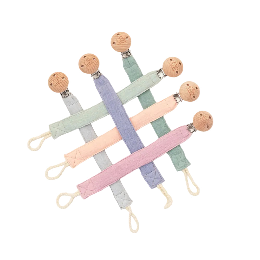 Set of pastel-colored pacifier clips on a white background