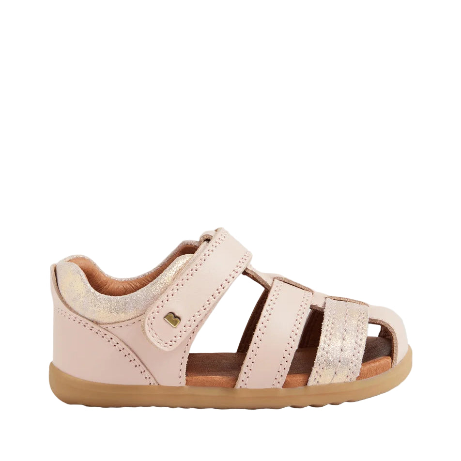 Pink children's sandal with a strap on a light gray background