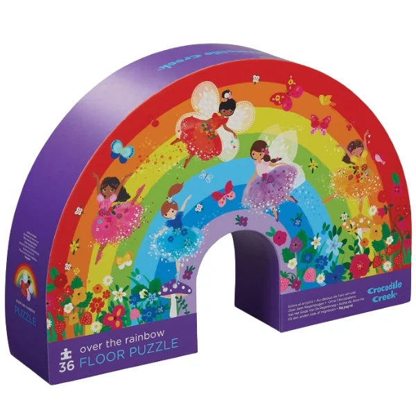 Colorful packaging of a floor puzzle with fairies and a rainbow design.