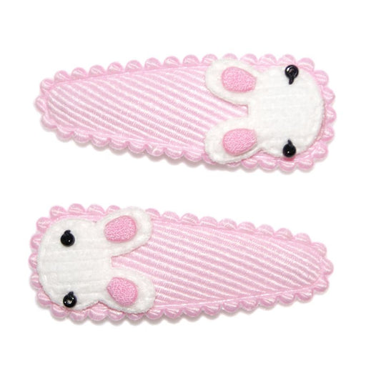 Two pink hair combs with white mouse designs on a white background