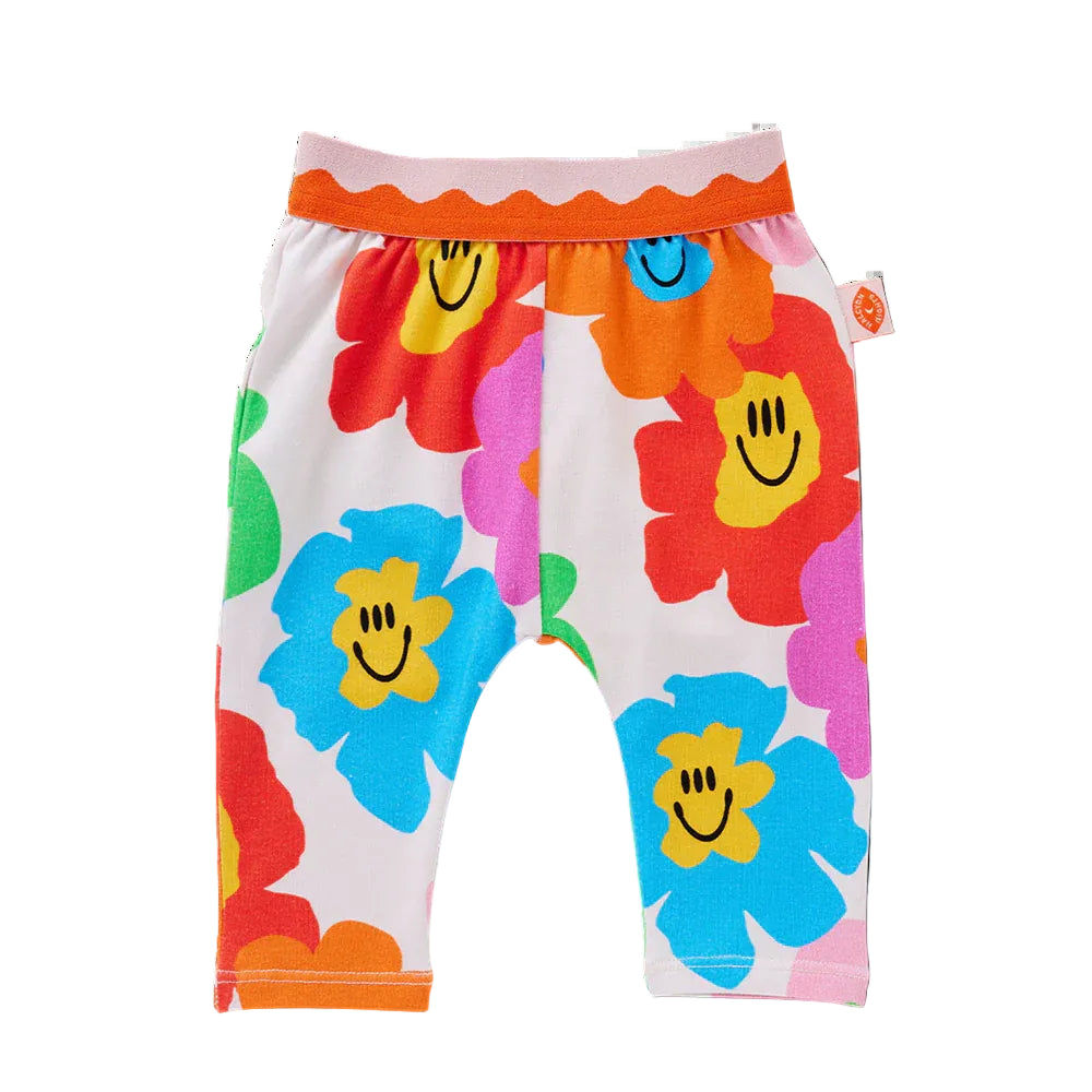 Colorful children's pants with smiley face flowers on a white background