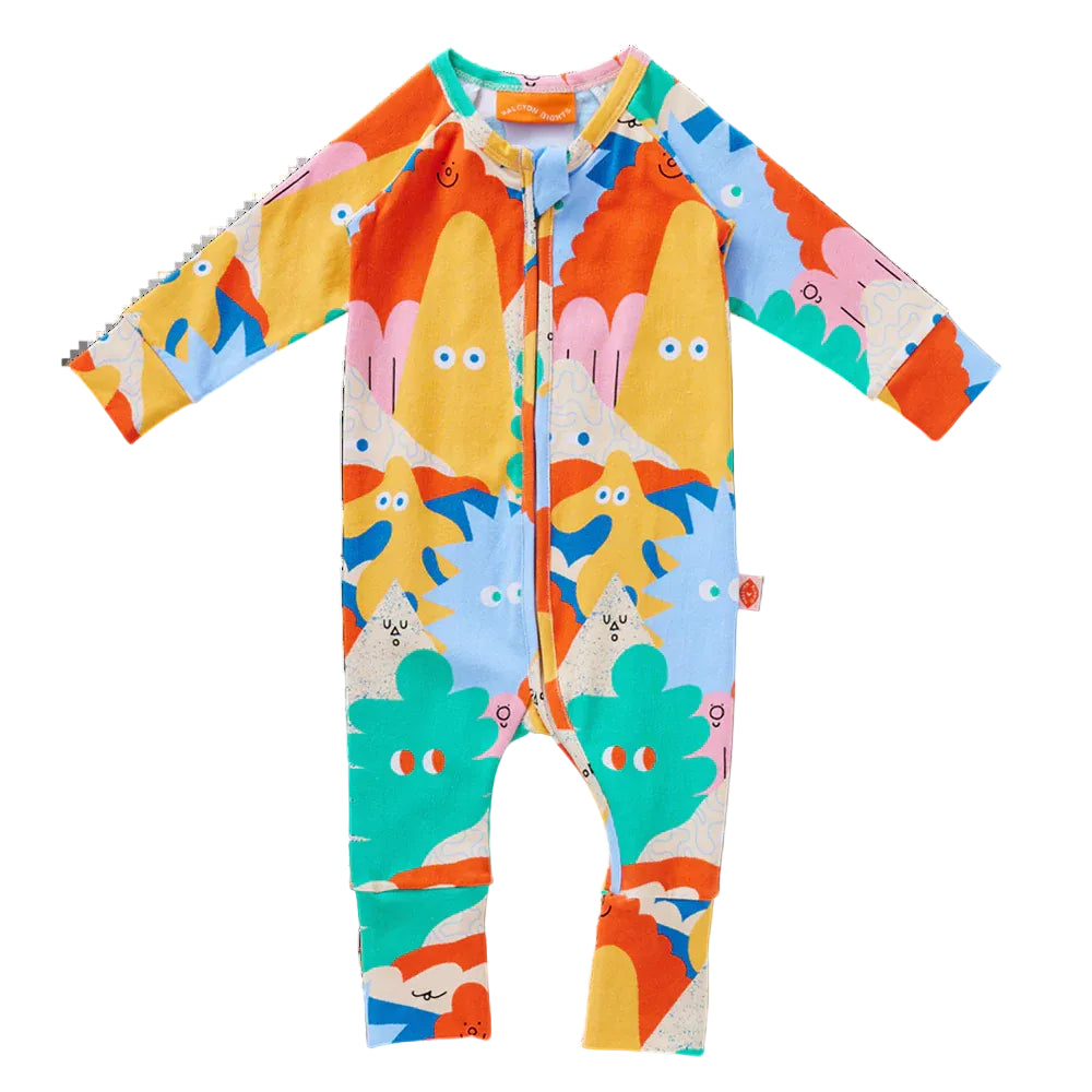 Colorful baby romper with cartoon character pattern on a white background