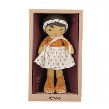 Doll in a wooden box with 'Kaloo' branding on a white background