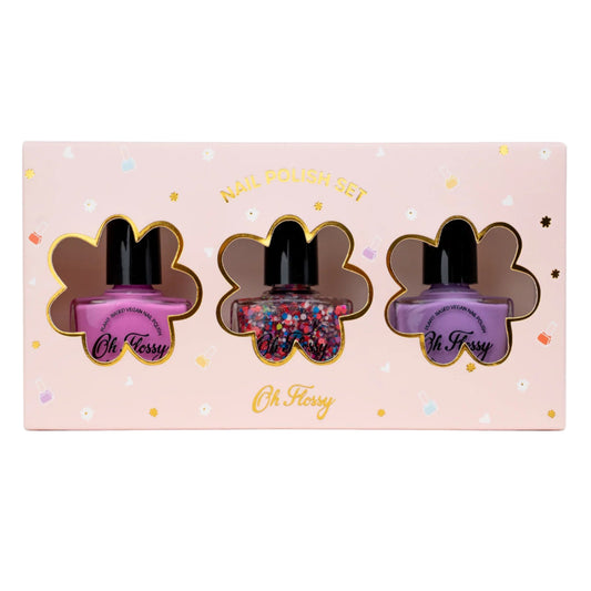 Three nail polish bottles in a decorative box with 'Oh Fessy' branding on a pink background.