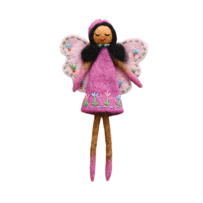 Felted fairy doll with pink wings and dress on a wooden stand against a white background

