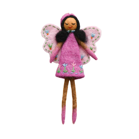 Felted fairy doll with pink wings and dress on a wooden stand against a white background

