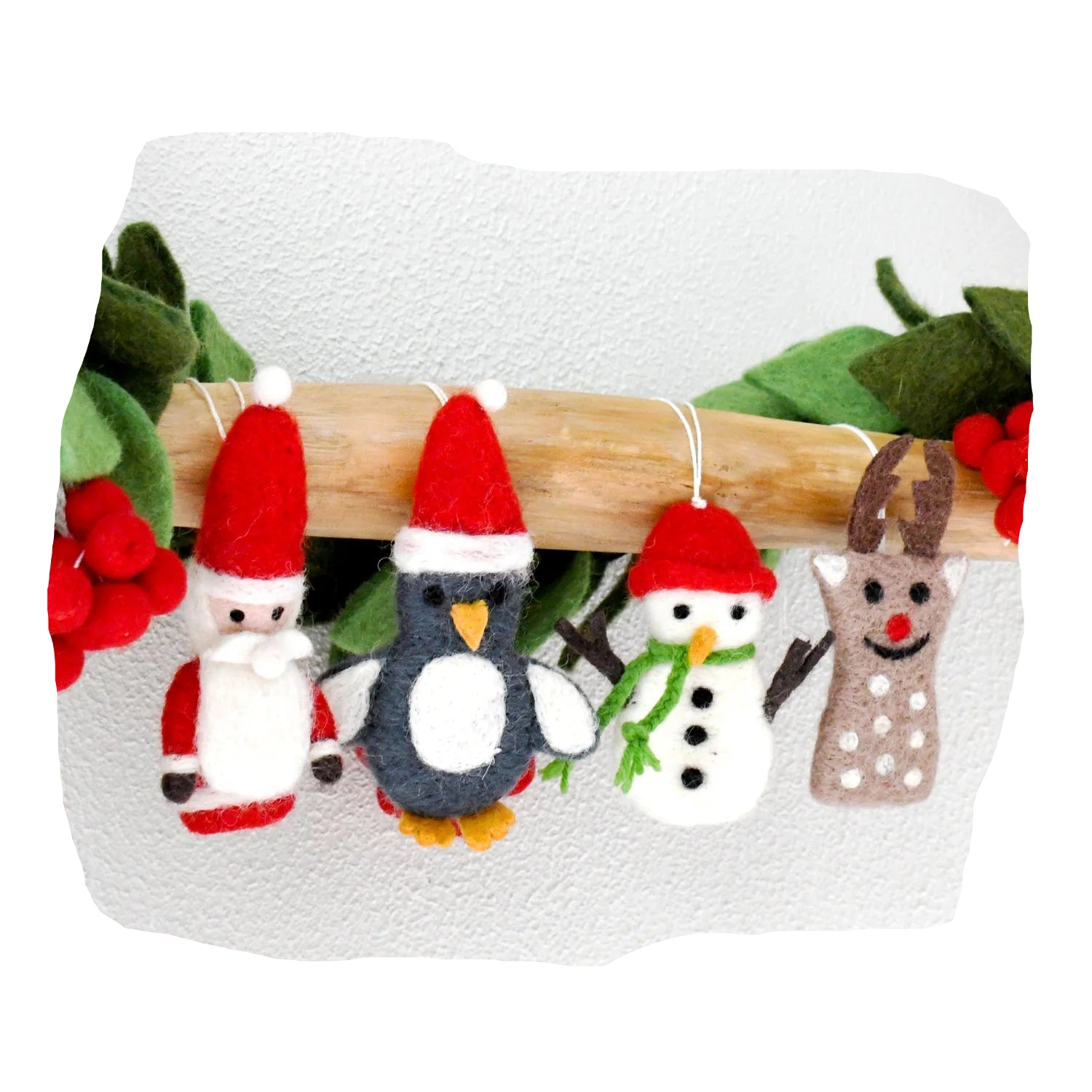Set of Christmas-themed ornaments including a snowman, penguin, reindeer, and snowflake on a wooden stick with a white background.