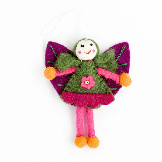 Colorful fairy toy with a pink dress and green wings on a white background