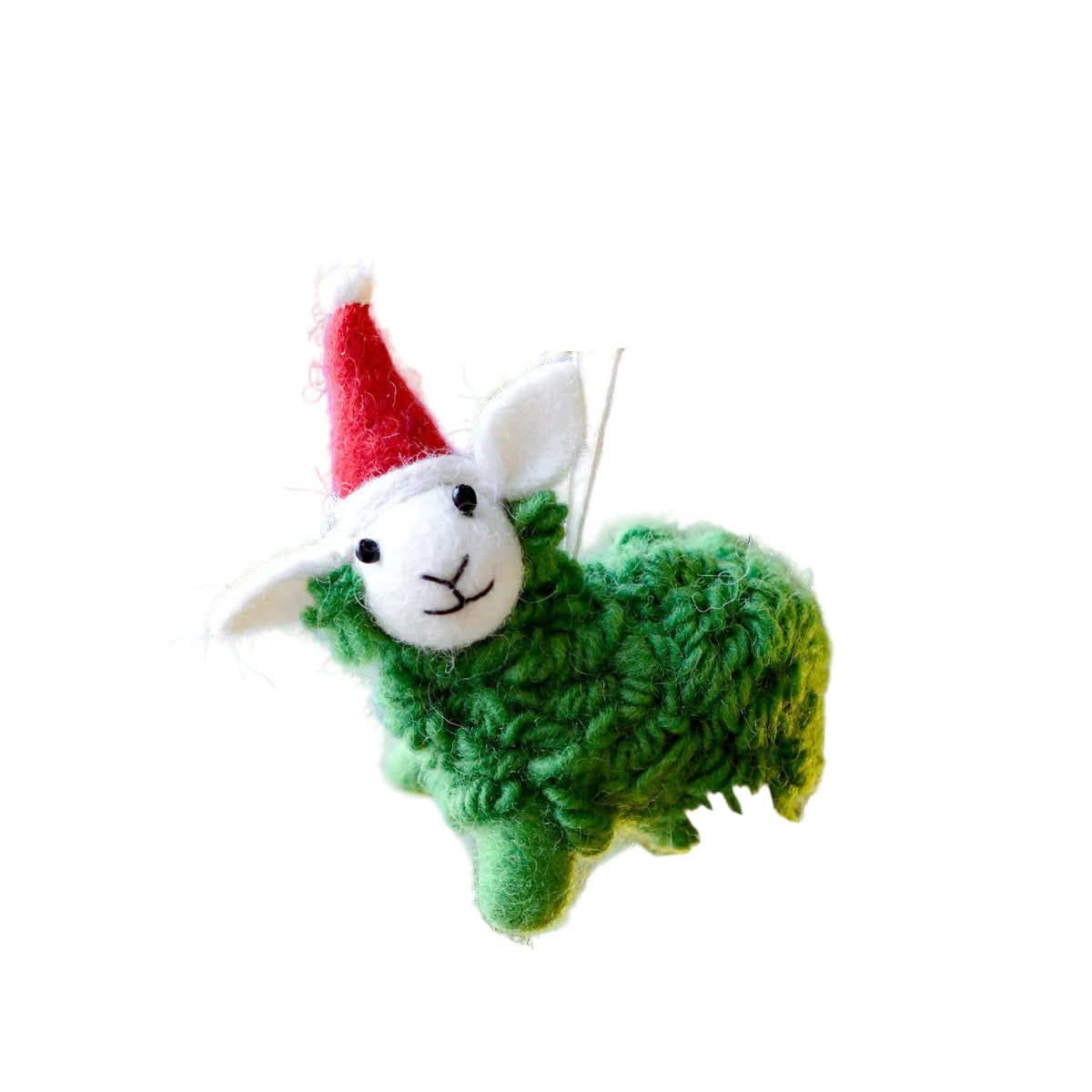 Knitted sheep ornament with a red hat hanging on a Christmas tree.