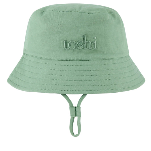 Green bucket hat with 'toshi' branding on a white background