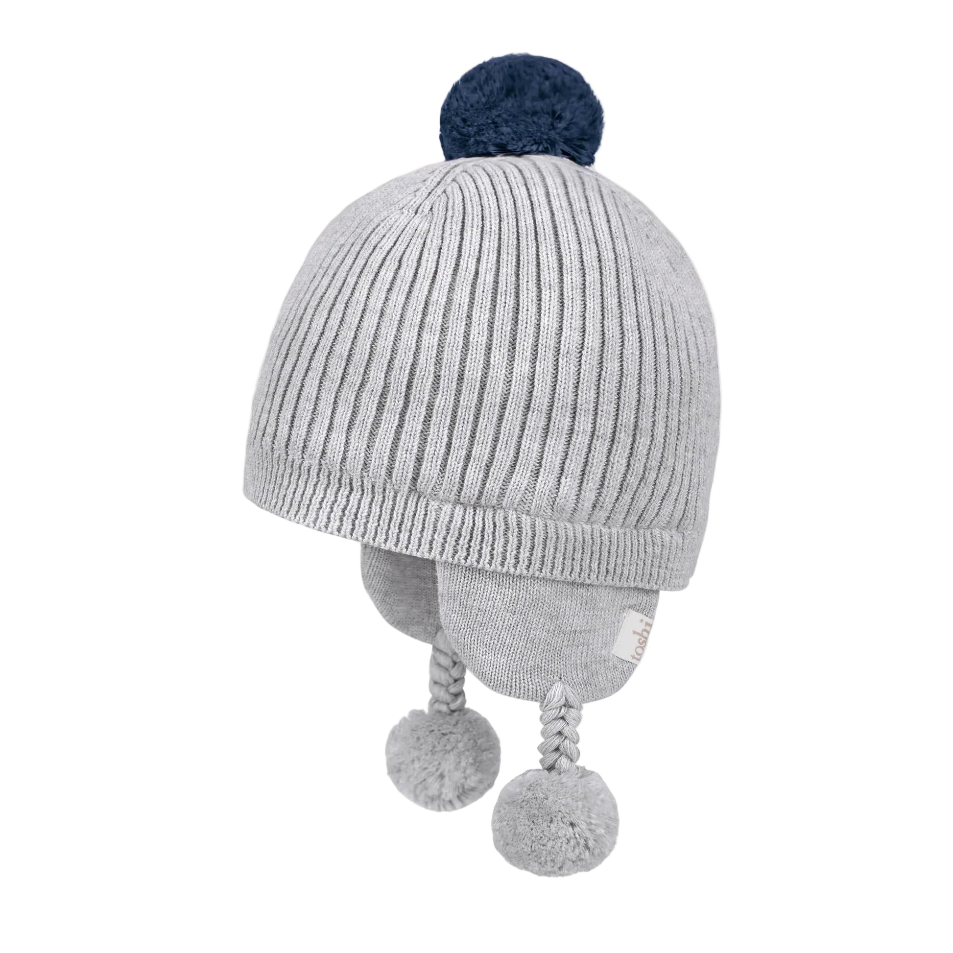 Gray knit baby hat with pom-poms on a white background