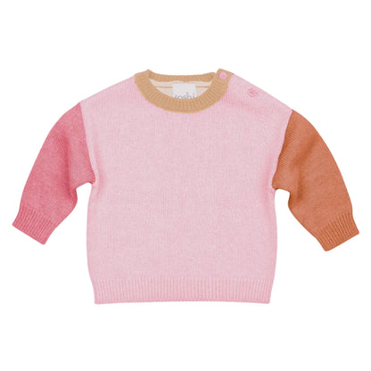 Pink sweater with brown sleeves on a light gray background