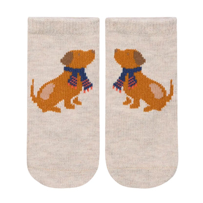 Pair of socks with a dog design on a beige background