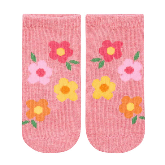 Pair of pink socks with colorful floral designs on a light gray background