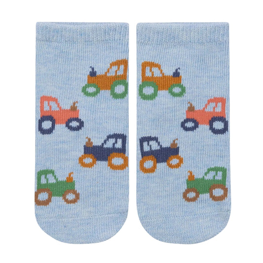 Pair of socks with toy car pattern on a light blue background