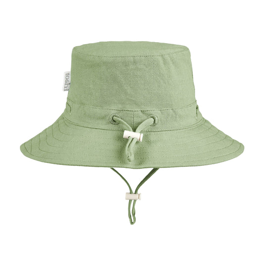 Green bucket hat with UPF 50+ sun safety label on a white background