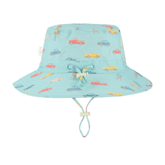 Children's sun hat with car pattern and UPF 50+ label on a light blue background