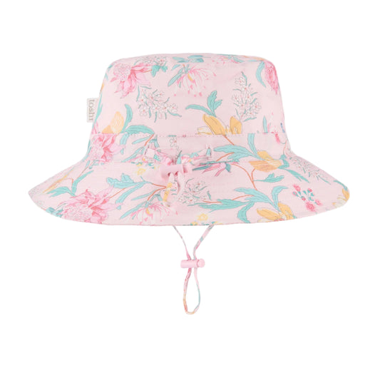 Floral patterned bucket hat with UPF 50+ sun safety label on a white background