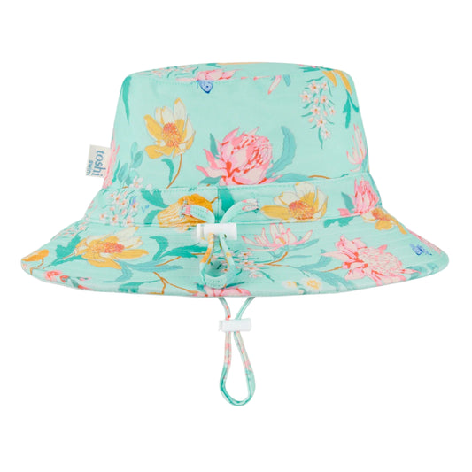 Floral-patterned bucket hat with UPF 50+ label on a light blue background