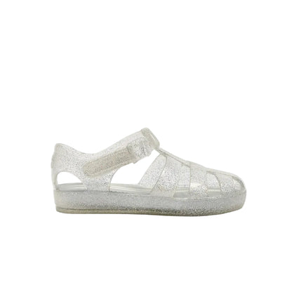 A single silver glitter jelly sandal for toddlers, shown from the side against a plain white background.